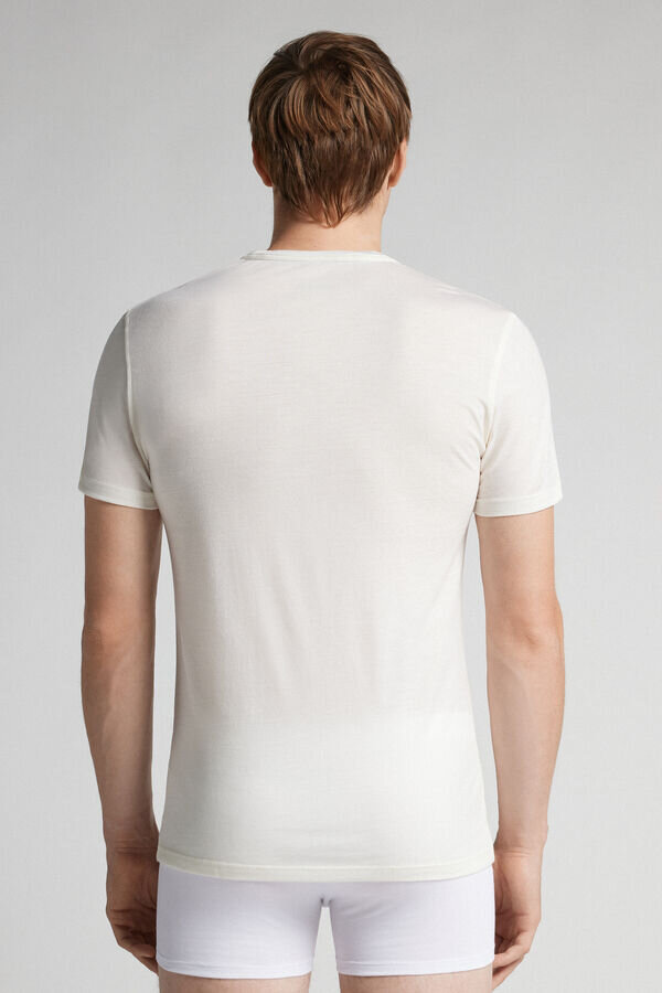 Μπλουζάκι με κοντό μανίκι από ελαστικό μαλλί μερινό Μπλουζάκι με κοντό μανίκι από ελαστικό μαλλί μερινό